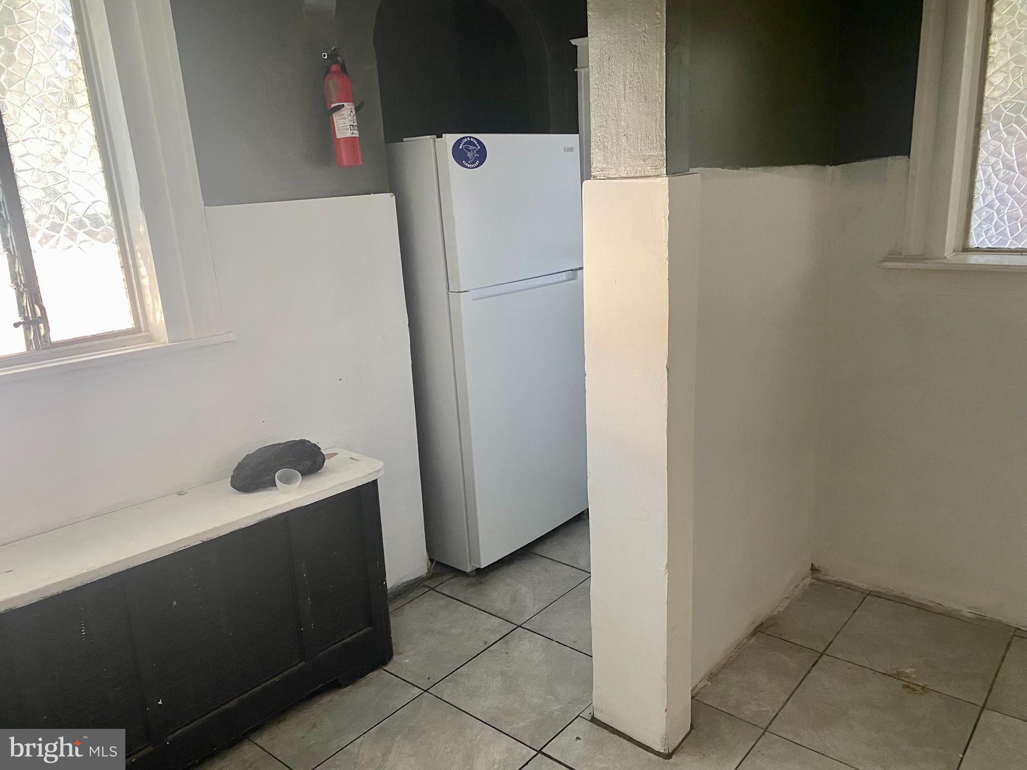 89 Lamport Road Upper Darby, PA 19082 - Photo 8 of 22 a white refrigerator freezer sitting in a kitchen