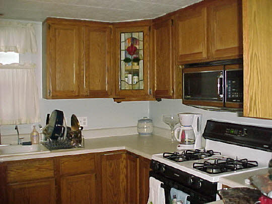 2582 Fischer Road South Beloit, IL 61080 - Photo 3 of 6 a kitchen with a sink stove top oven and cabinets