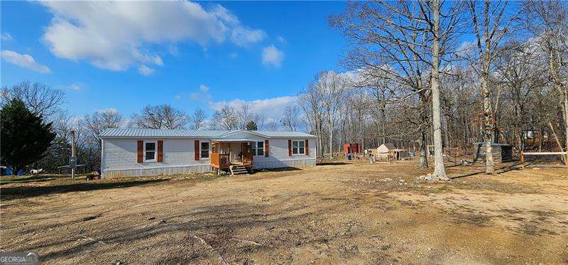 a view of a house with a snow in front of it
