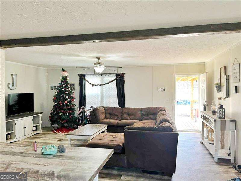 349 Dublin Circle Rome, GA 30161 - Photo 5 of 11 a living room with furniture and a flat screen tv