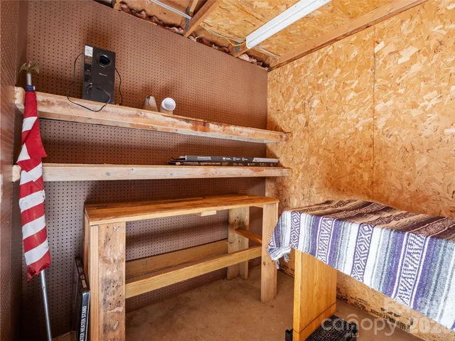 a view of a street sign under a large tree