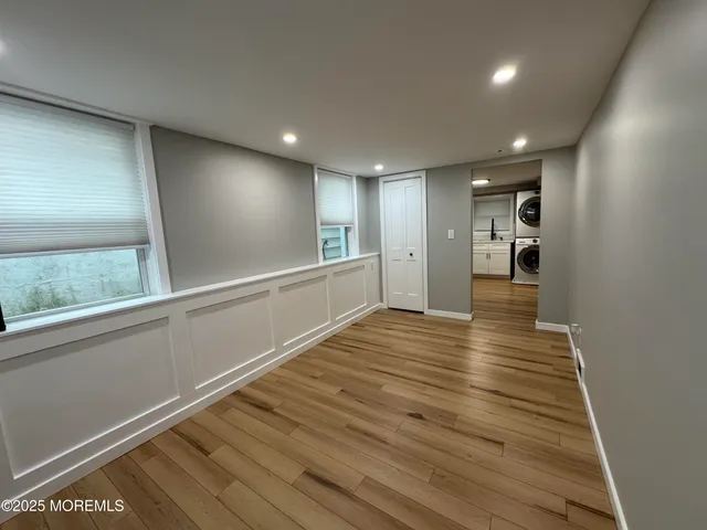 a view of a room with wooden floor
