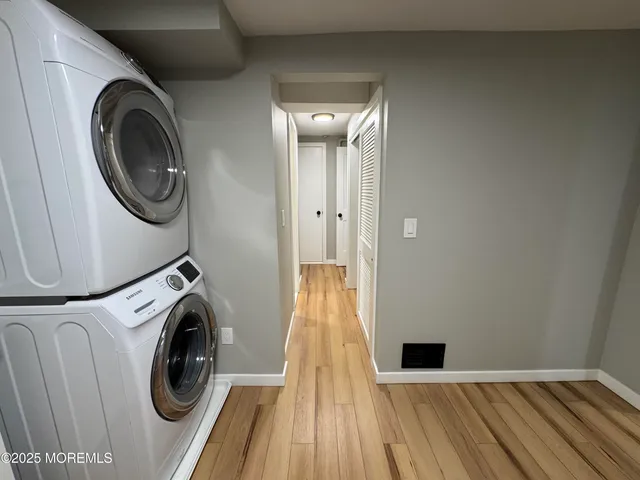 a view of livingroom with washer and dryer