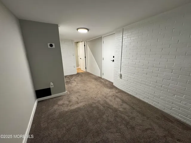 a view of a big room with closet and wooden floor