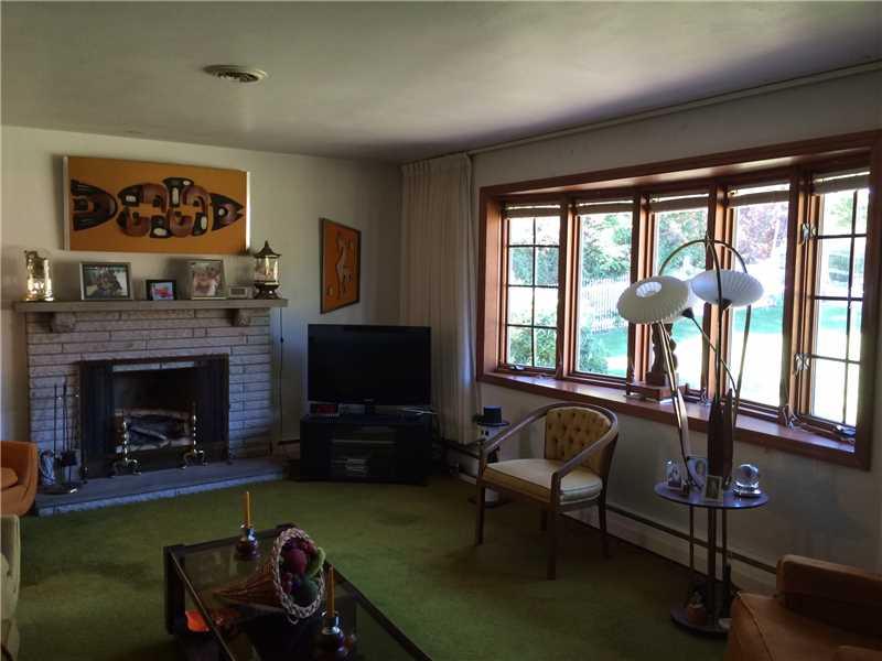 18 East Ridge Road Coraopolis, PA 15108 - Photo 3 of 24 Living Room. Bay Window, for the Stoesun to Warm your Heart, and Log Burning Fireplace to warm Help