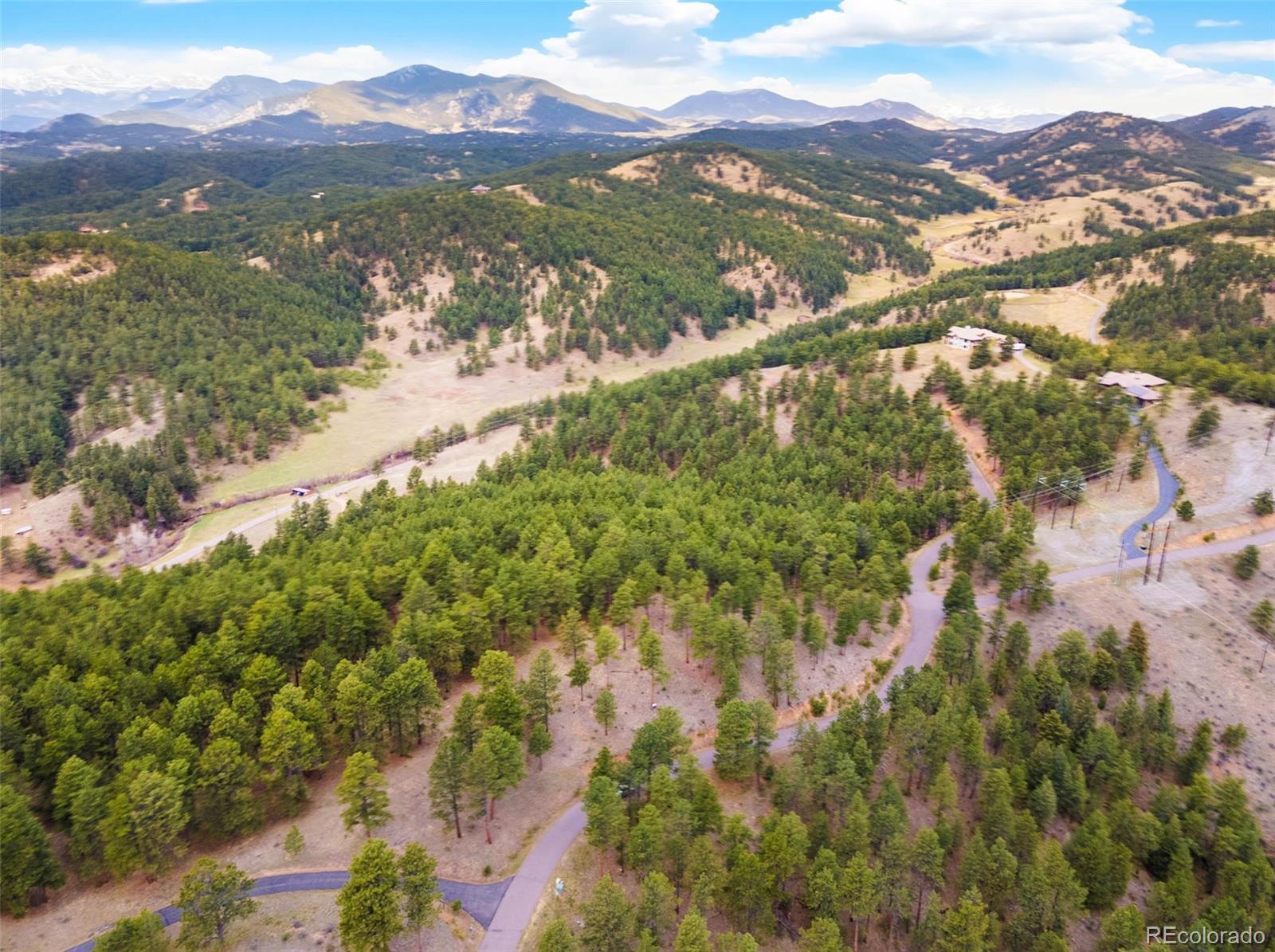 2859 Highlands View Road Evergreen, CO 80439 - Photo 18 of 22 a view of a city with mountains in the background