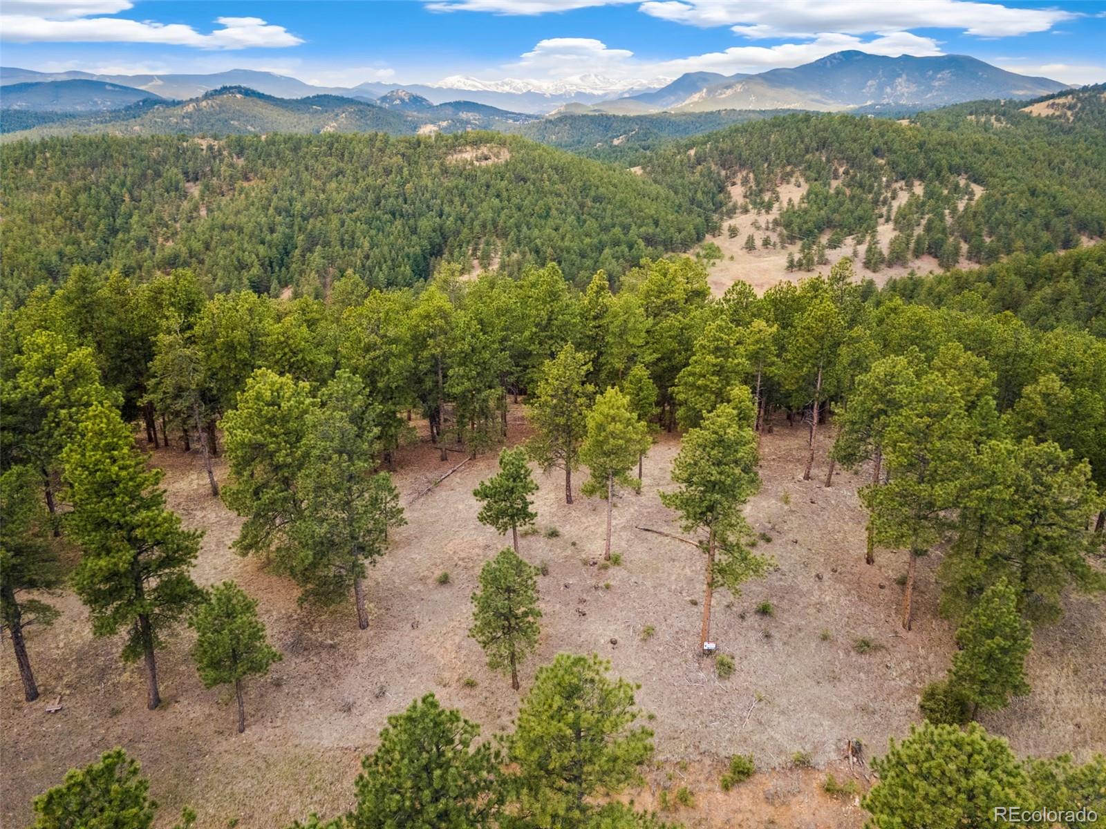 2859 Highlands View Road Evergreen, CO 80439 - Photo 4 of 22 a view of a lake with mountains in the background