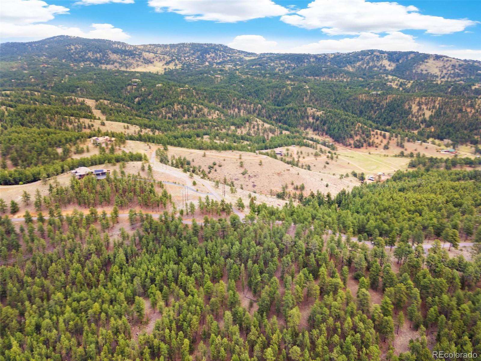 2859 Highlands View Road Evergreen, CO 80439 - Photo 7 of 22 a view of a city with mountains in the background