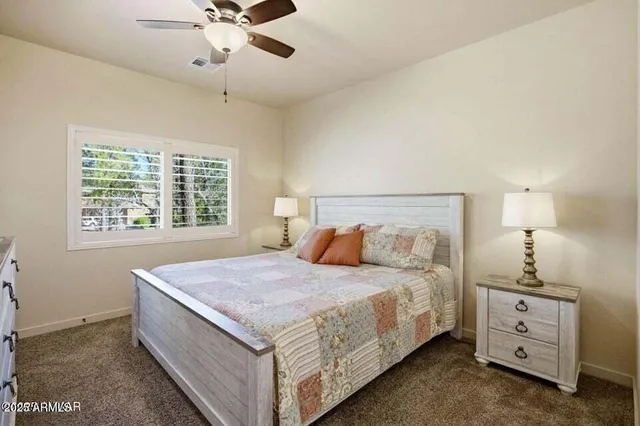 a bedroom with a bed and window