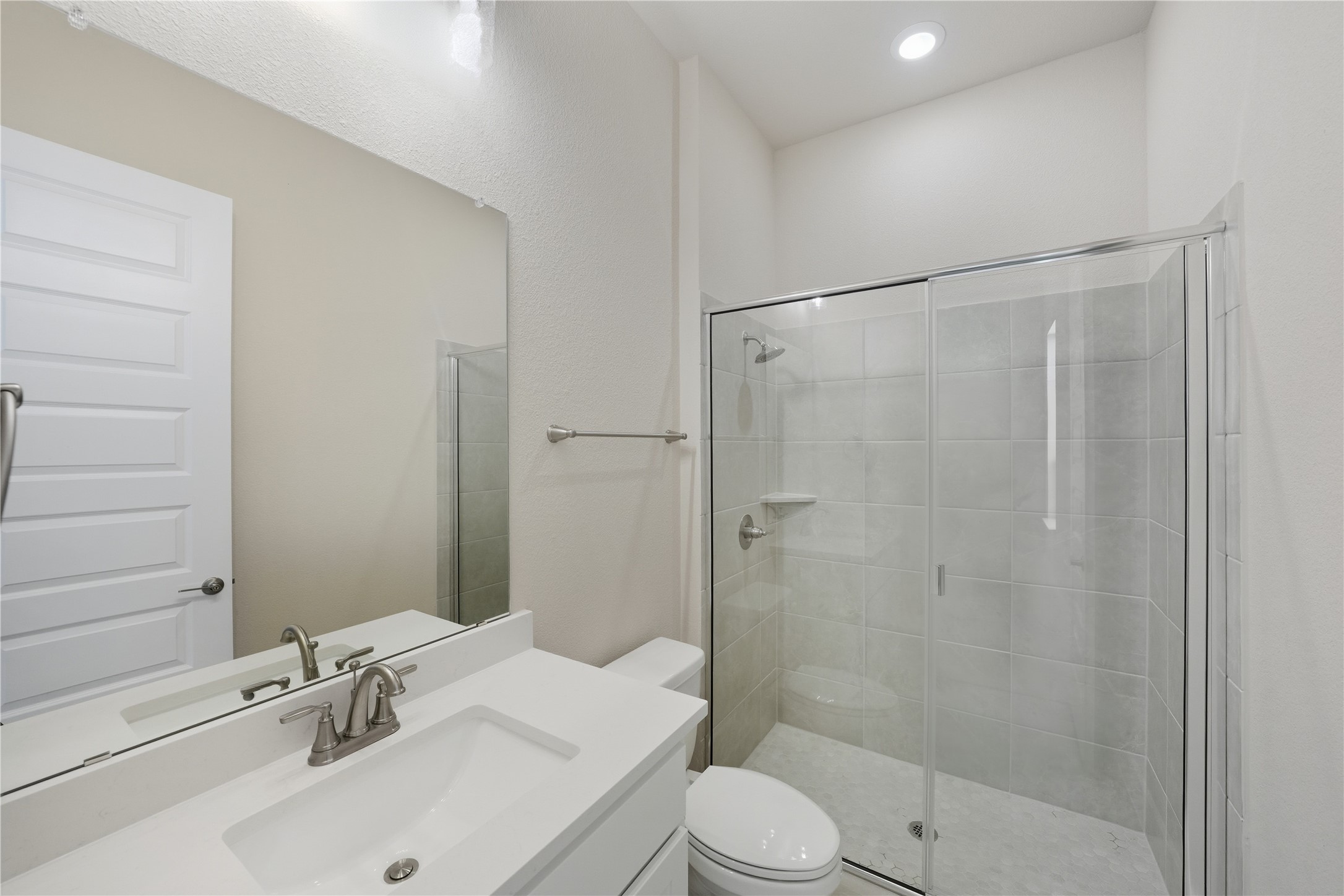 1209 Doelling Drive Georgetown, TX 78633 - Photo 18 of 31 Bathroom with a shower stall, vanity, and recessed lighting