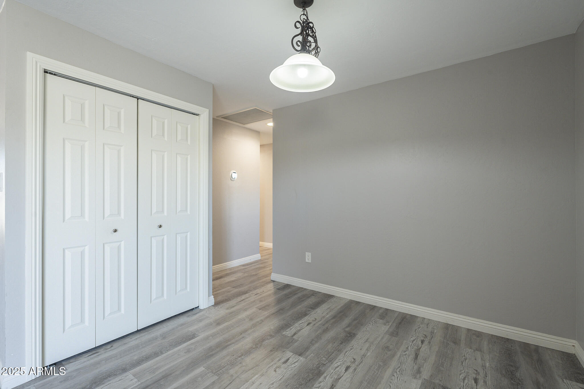 2914 East Cactus Road Phoenix, AZ 85032 - Photo 18 of 49 wooden floor in an empty room