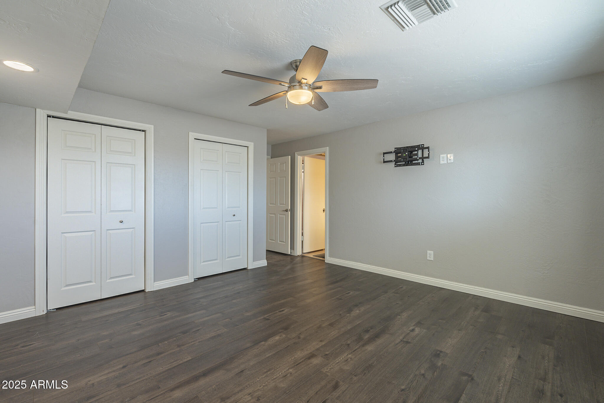 2914 East Cactus Road Phoenix, AZ 85032 - Photo 27 of 49 wooden floor in an empty room with a window