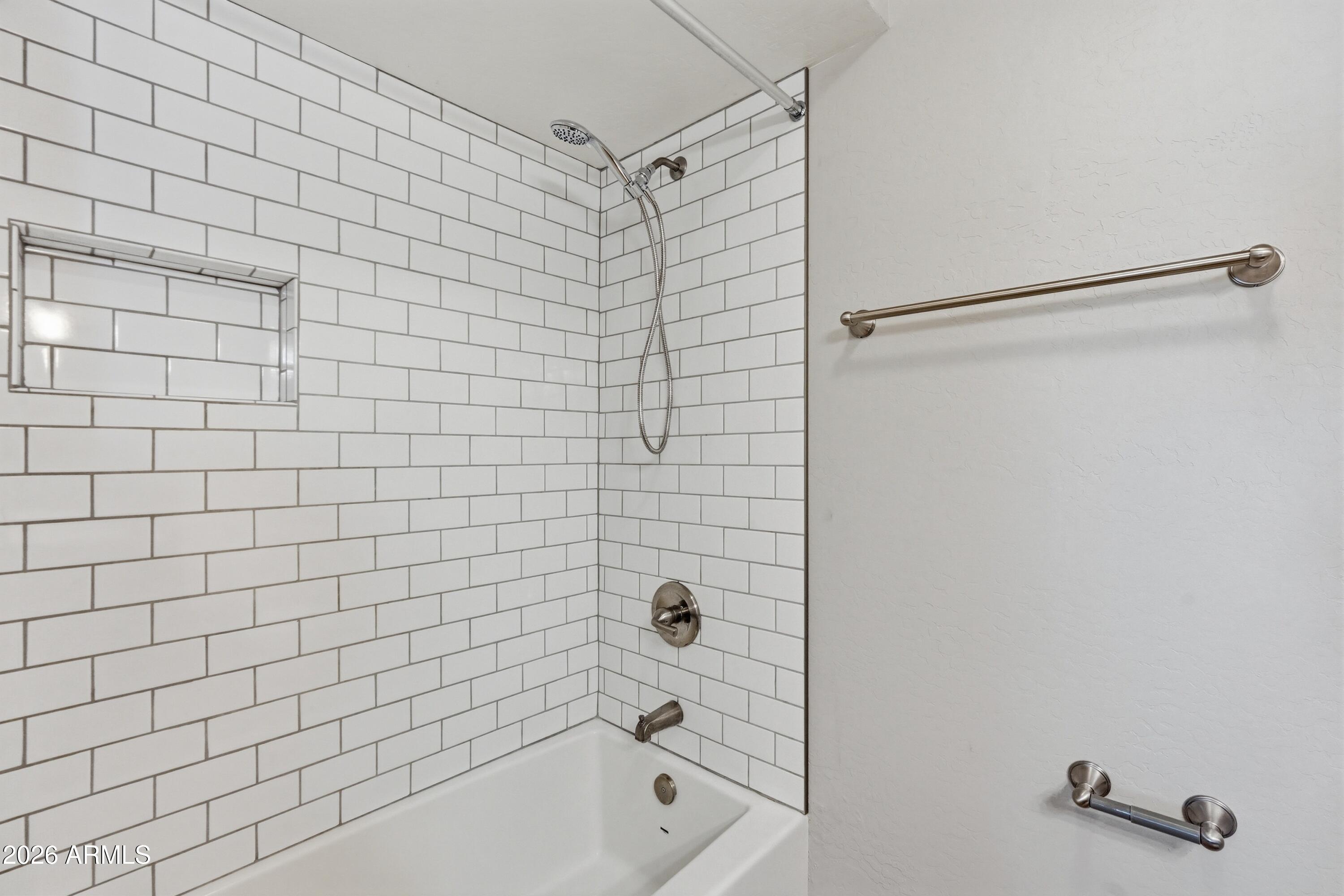 2914 East Cactus Road Phoenix, AZ 85032 - Photo 27 of 40 a bathroom with a shower and a bathtub