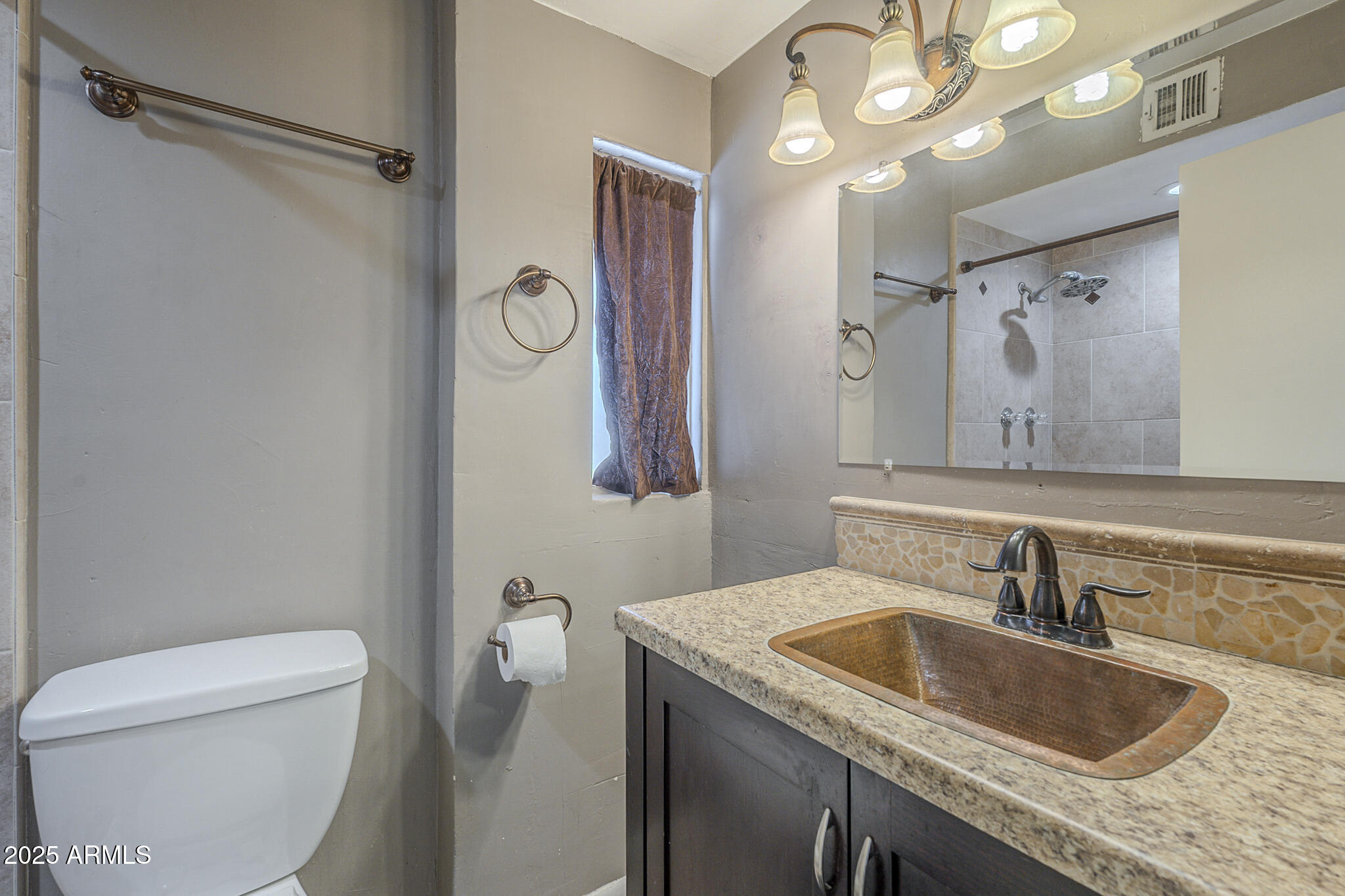 2914 East Cactus Road Phoenix, AZ 85032 - Photo 31 of 49 a bathroom with a granite countertop sink a toilet and a mirror