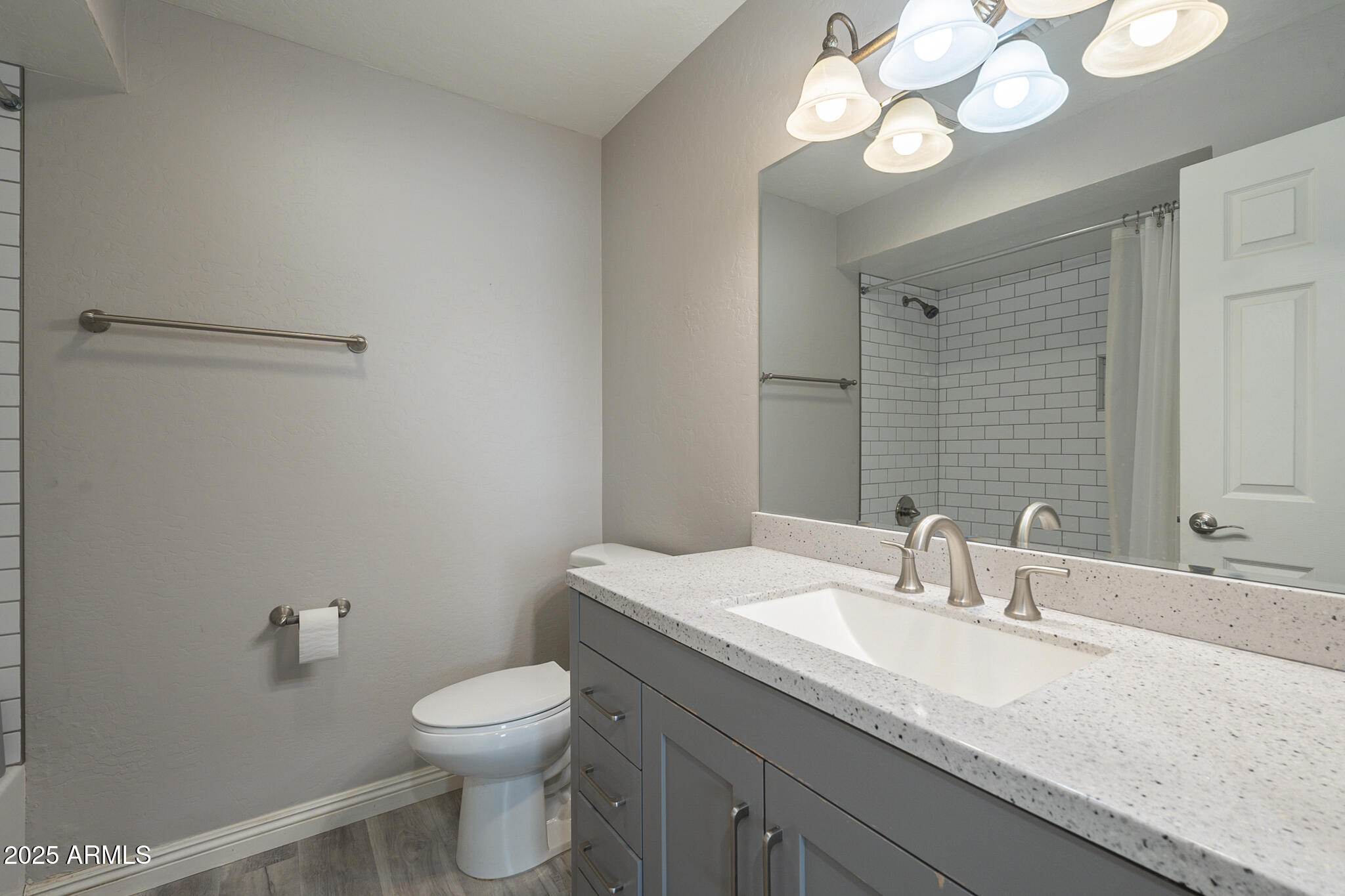 2914 East Cactus Road Phoenix, AZ 85032 - Photo 32 of 49 a bathroom with a sink a toilet and a mirror