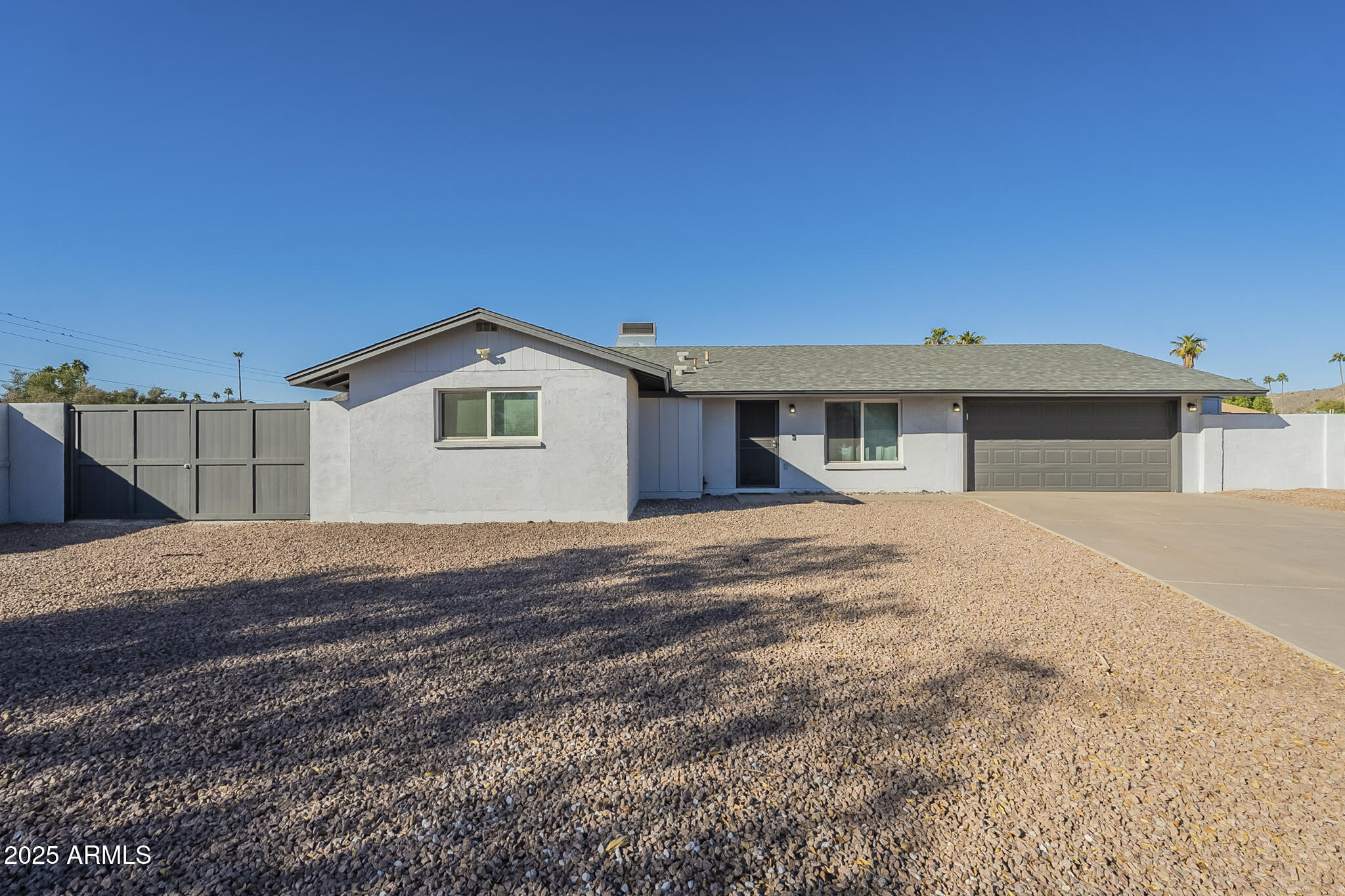 2914 East Cactus Road Phoenix, AZ 85032 - Photo 4 of 49 a view of a house with a backyard