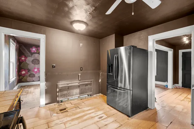 a bathroom with a toilet and a window