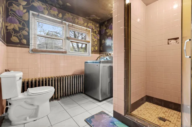 a view of a utility room with washer and dryer
