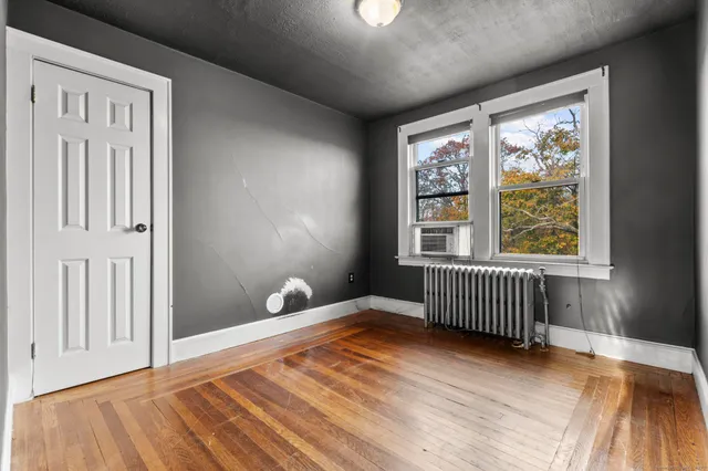 a view of livingroom with hardwood floor and a ceiling fan