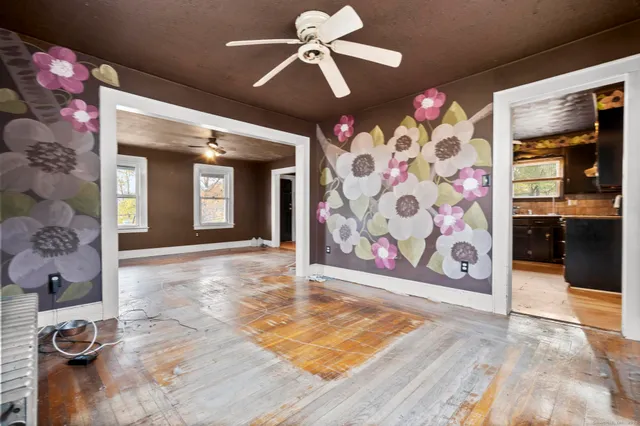a large kitchen with stainless steel appliances granite countertop a sink stove and refrigerator