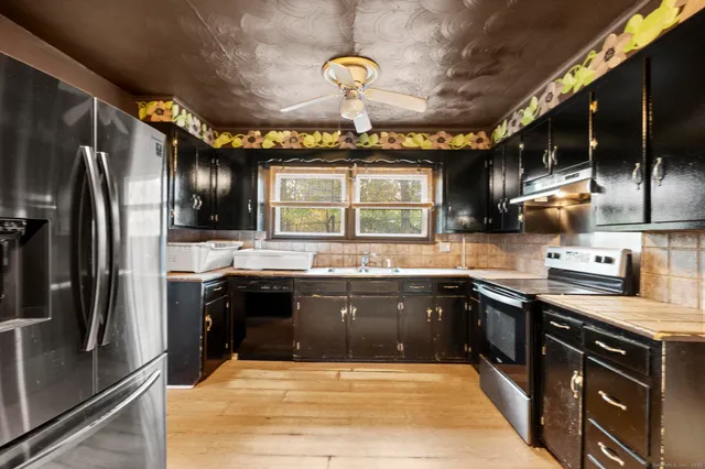 a kitchen with a stove and a microwave
