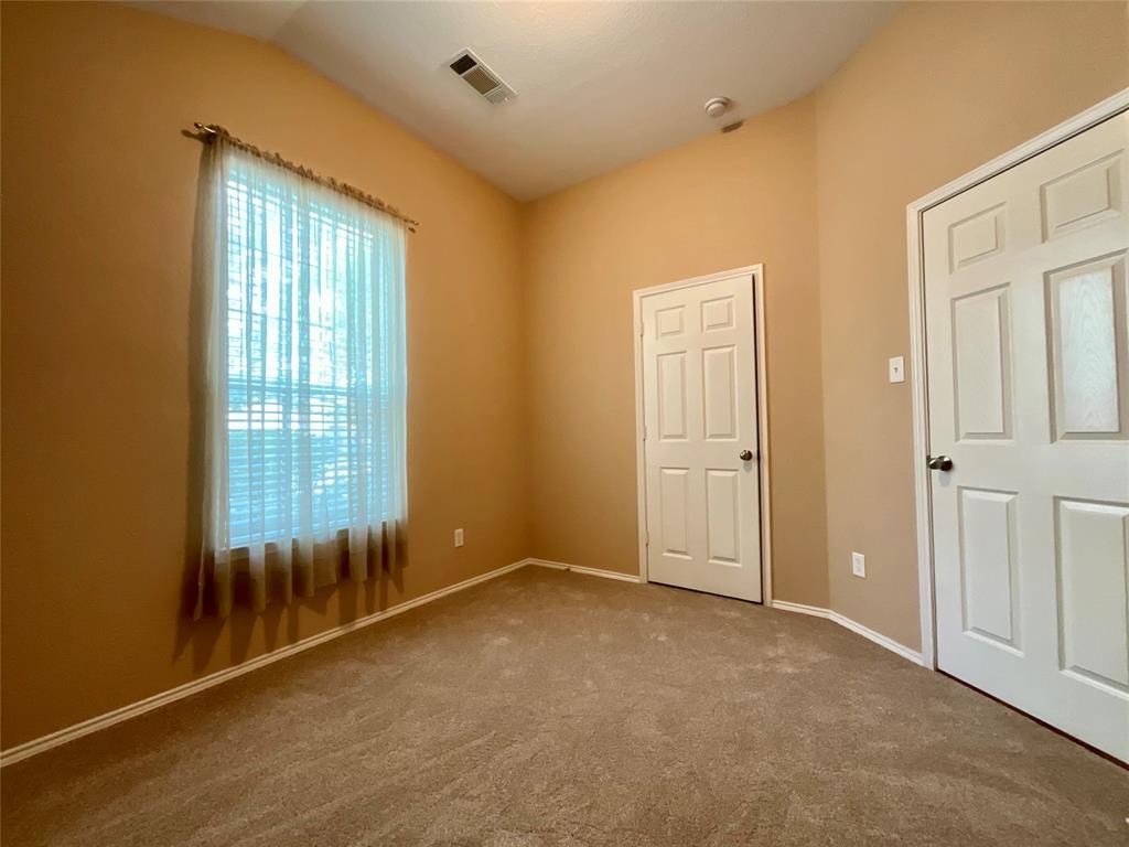 14044 Fontana Road Roanoke, TX 76262 - Photo 11 of 14 Vaulted ceiling, window with blinds, panel doors, and neutral carpeting