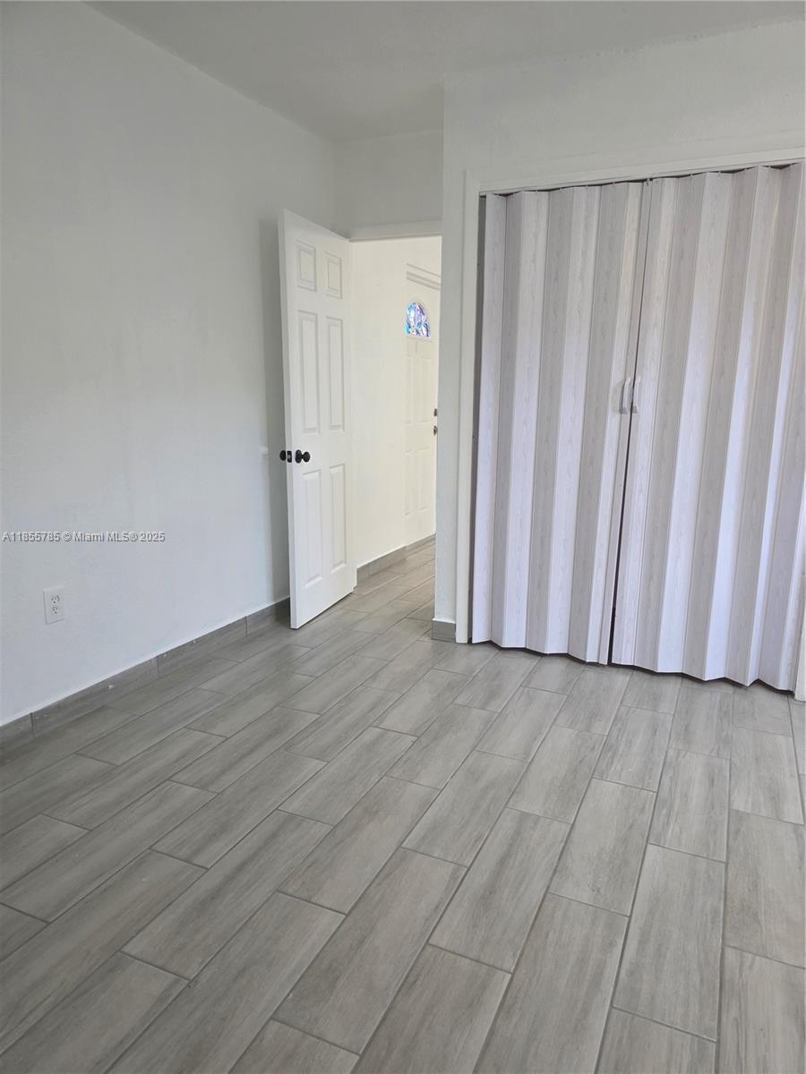 359 West 12th Street, Unit 2 Hialeah, FL 33010 - Photo 14 of 20 a view of a livingroom with wooden floor