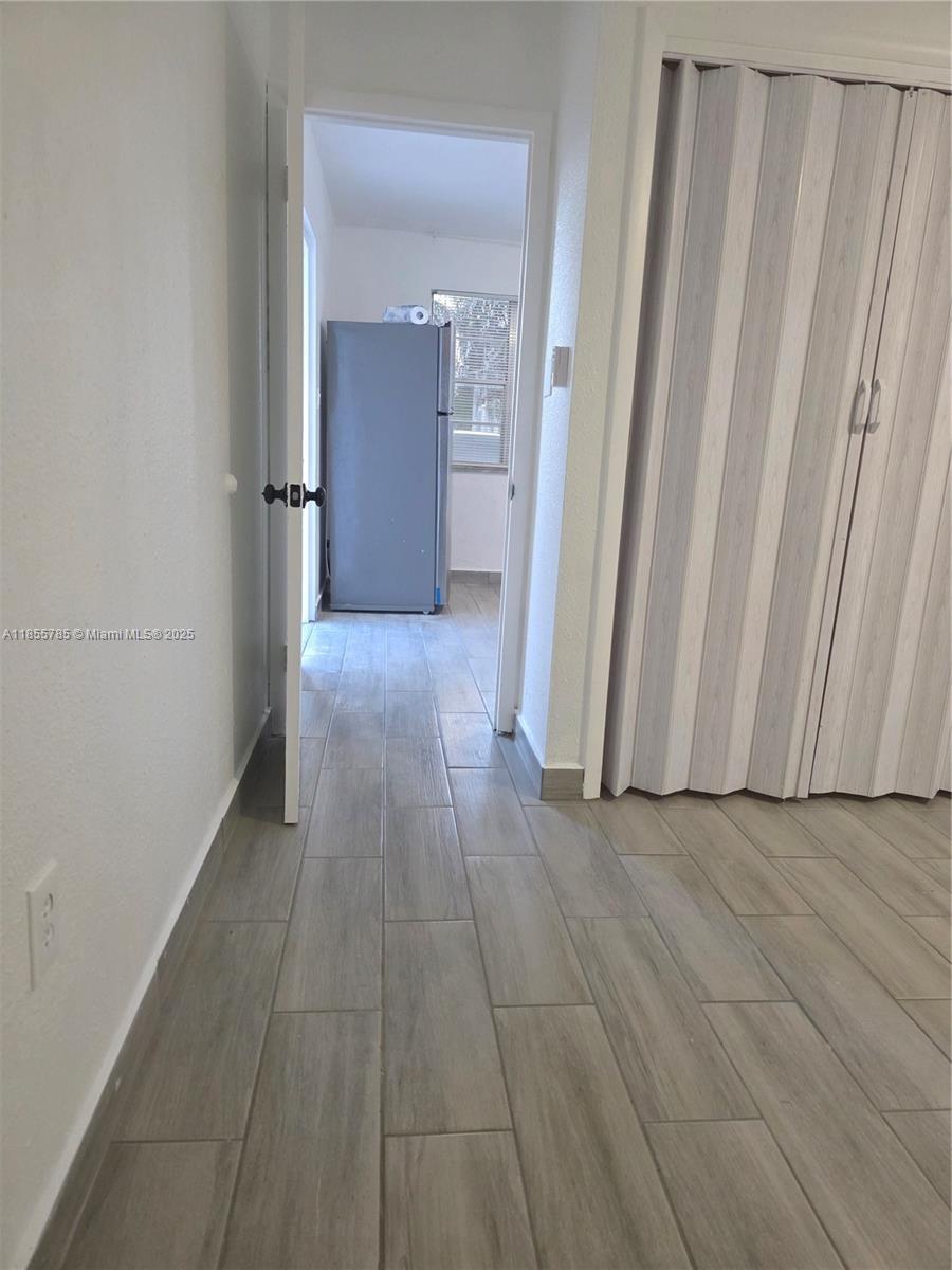 359 West 12th Street, Unit 2 Hialeah, FL 33010 - Photo 5 of 20 a view of a livingroom with wooden floor and a sink
