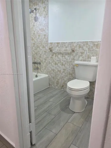 a bathroom with a toilet and a sink