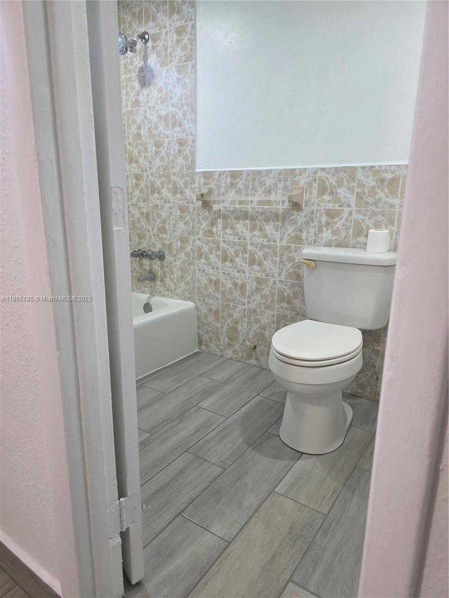 359 West 12th Street, Unit 2 Hialeah, FL 33010 - Photo 7 of 20 a bathroom with a toilet and a sink