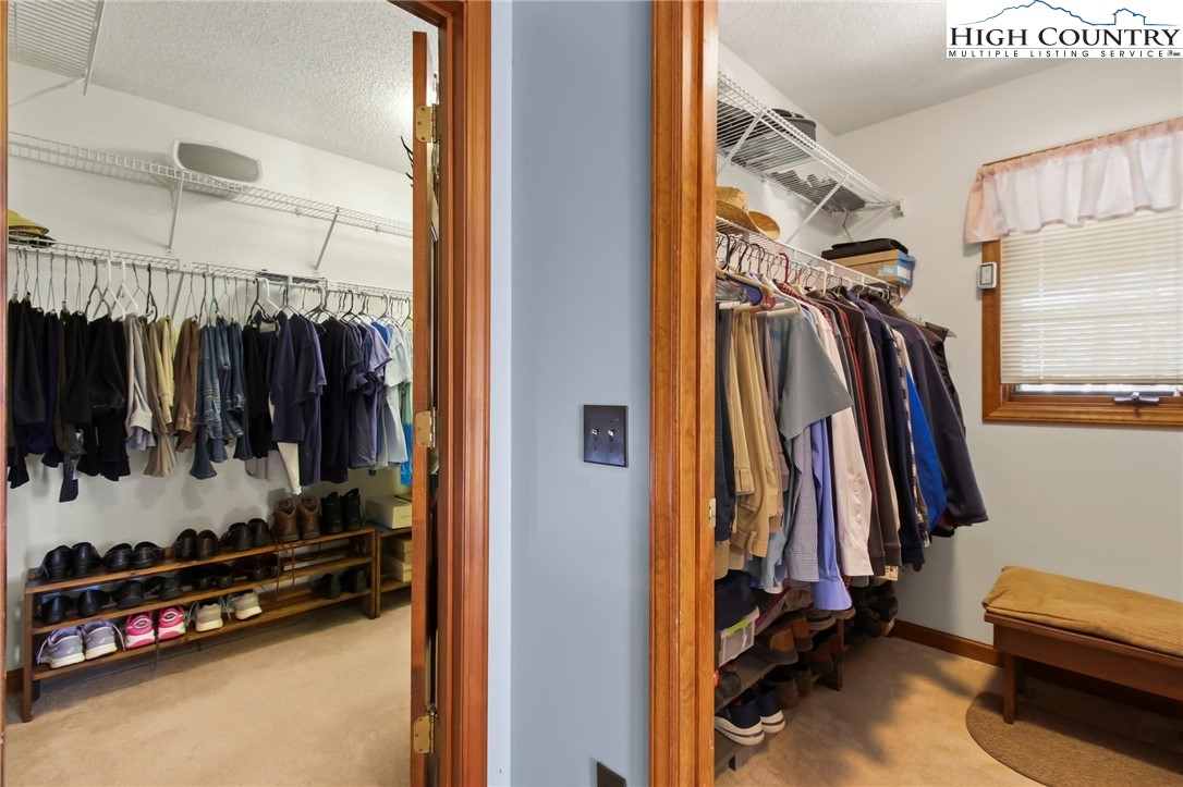 454 Huckleberry Trail Boone, NC 28607 - Photo 19 of 36 a view of walk in closet with clothes and shoes