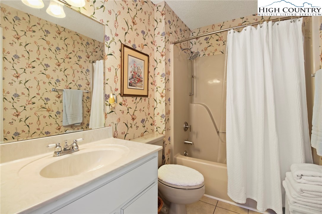 454 Huckleberry Trail Boone, NC 28607 - Photo 26 of 36 a bathroom with a sink toilet and shower