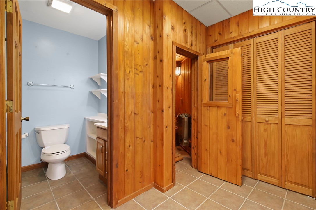 454 Huckleberry Trail Boone, NC 28607 - Photo 30 of 36 a bathroom with a toilet and a shower