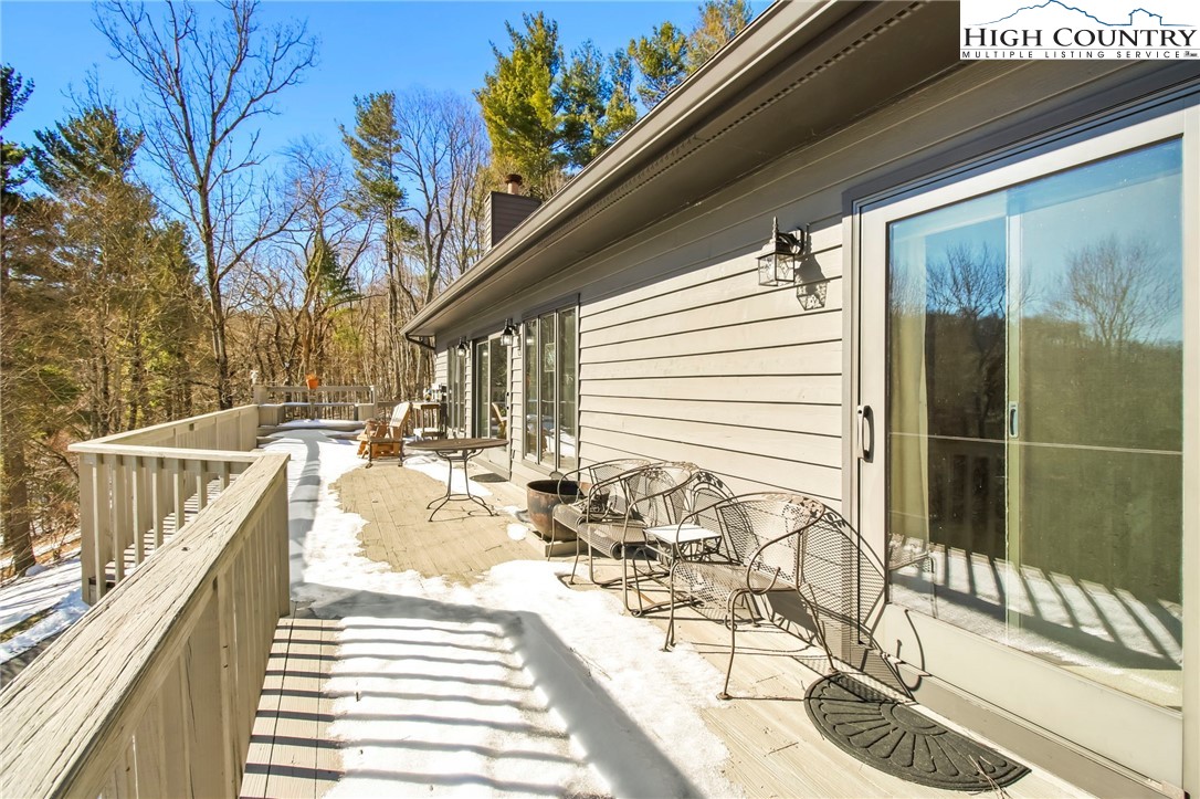 454 Huckleberry Trail Boone, NC 28607 - Photo 32 of 36 a view of a balcony with chairs