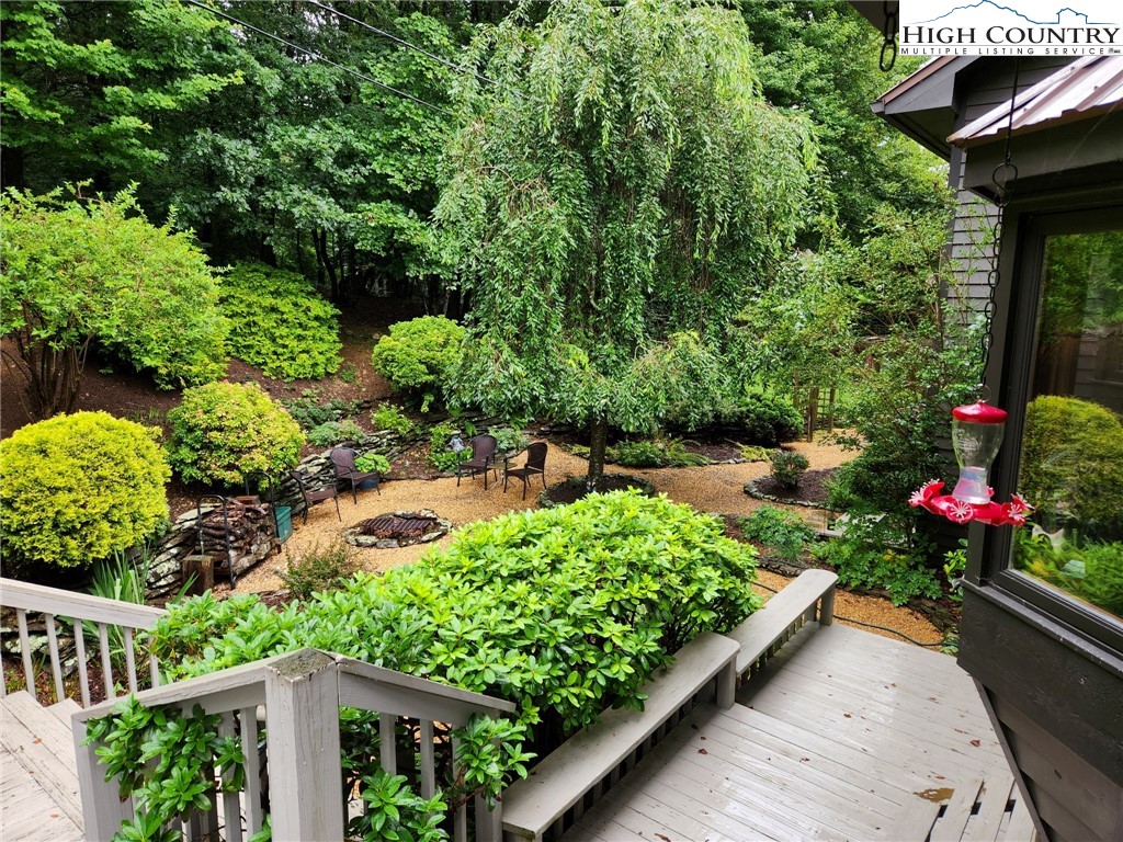 454 Huckleberry Trail Boone, NC 28607 - Photo 8 of 36 a view of a garden with flowers