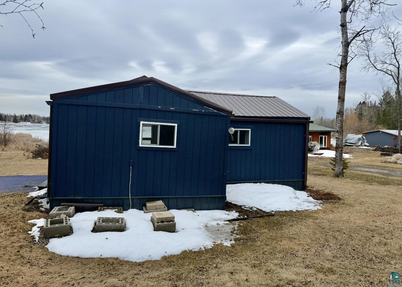 9572 Bonner Road Mountain Iron, MN 55768 - Photo 18 of 20 View of snowy exterior with a metal roof