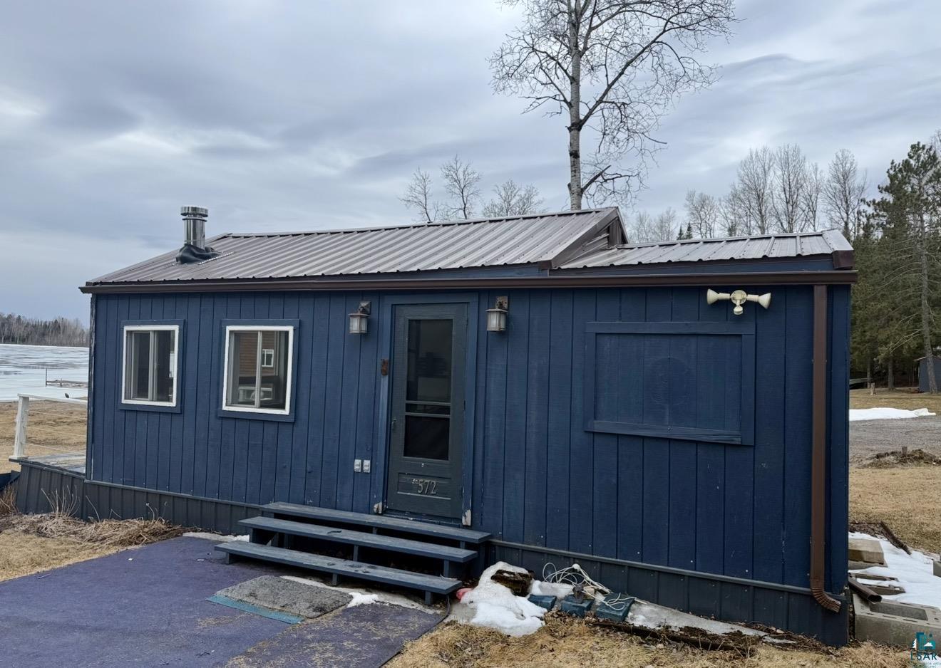 9572 Bonner Road Mountain Iron, MN 55768 - Photo 19 of 20 Rear view of property featuring entry steps and a metal roof