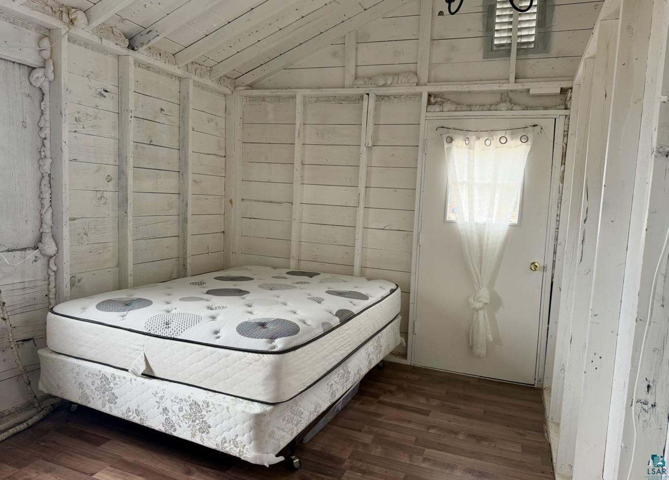 9572 Bonner Road Mountain Iron, MN 55768 - Photo 9 of 20 Bedroom featuring dark wood-style floors and vaulted ceiling