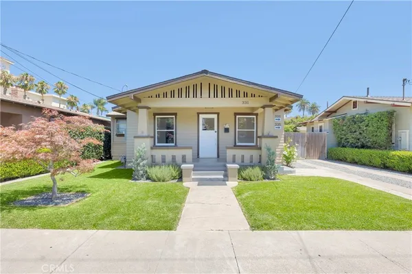 a view of house with yard
