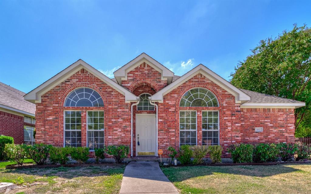 4012 Timberglen Road Dallas, TX 75287 - Photo 1 of 1 a front view of a house with garden