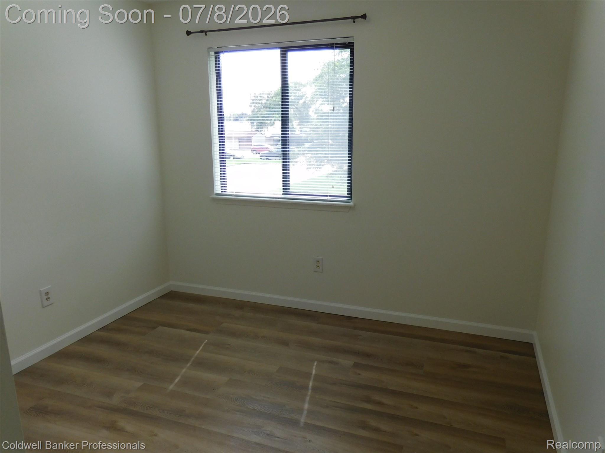 284 East 13 Mile Road Madison Heights, MI 48071 - Photo 14 of 21 Room featuring wood-finish flooring, neutral wall tones, and white baseboards