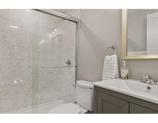 2 Abbott Road Natick, MA 01760 - Photo 15 of 23 a bathroom with a sink mirror and a shower