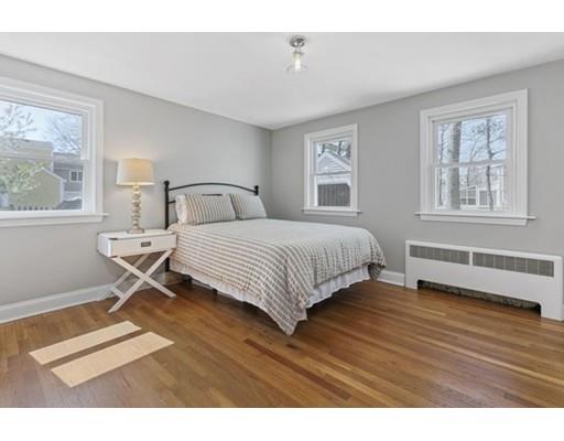 2 Abbott Road Natick, MA 01760 - Photo 16 of 23 a bedroom with a bed a table and windows