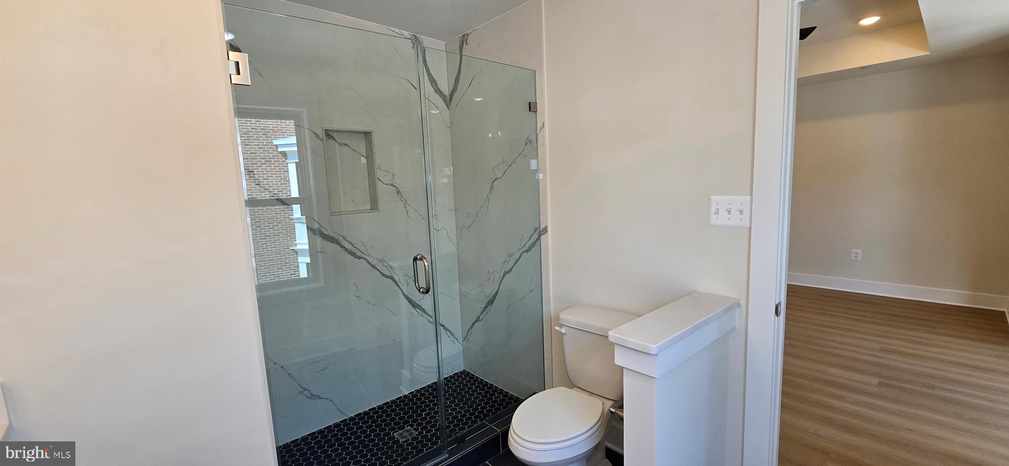 416 Chapel Alley, Unit 3 Frederick, MD 21701 - Photo 27 of 41 a bathroom with a toilet and a shower