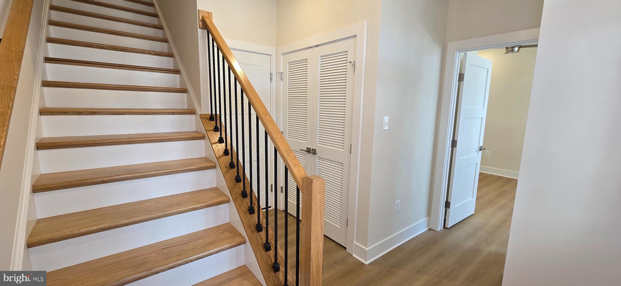 416 Chapel Alley, Unit 3 Frederick, MD 21701 - Photo 4 of 41 a view of a hallway with wooden floor and entryway