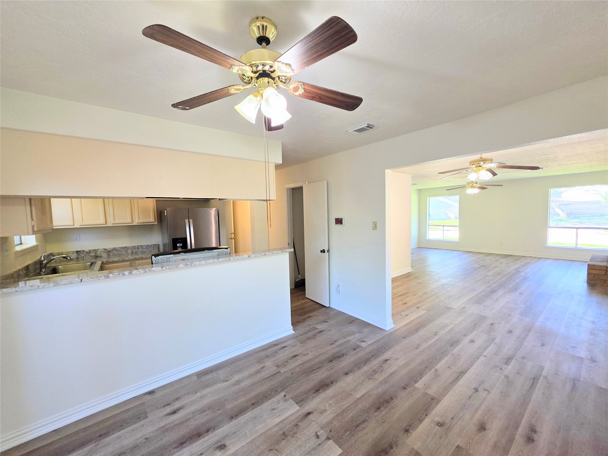 24022 Spring Briar Lane Spring, TX 77373 - Photo 6 of 35 Kitchen opening to dining and livingroom area