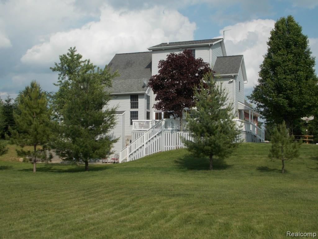 2974 Hannan Road Imlay City, MI 48444 - Photo 3 of 45 Nice trees planted around spectacular home.