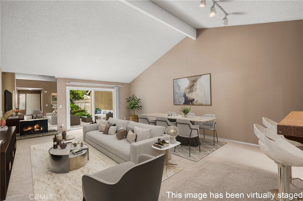 10 Greenbriar, Unit 31 Irvine, CA 92604 - Photo 2 of 46 a living room with furniture two window and a table