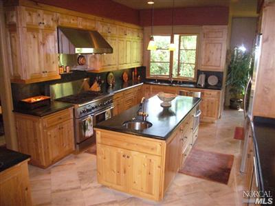 4 Rock Road Kentfield, CA 94904 - Photo 3 of 12 a kitchen with stainless steel appliances granite countertop a stove a sink and a microwave