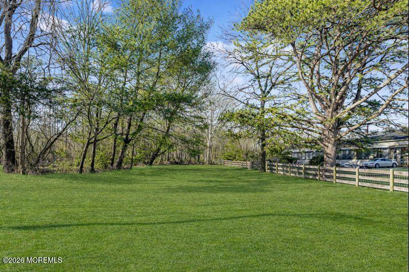 66 Cedar Swamp Road Jackson, NJ 08527 - Photo 15 of 56 a grassy field with trees in the background